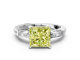 White gold Fancy Yellow Princess  Solitaire with Tapered Baguette Side Stones on a Classic Band with Four-Prong Setting