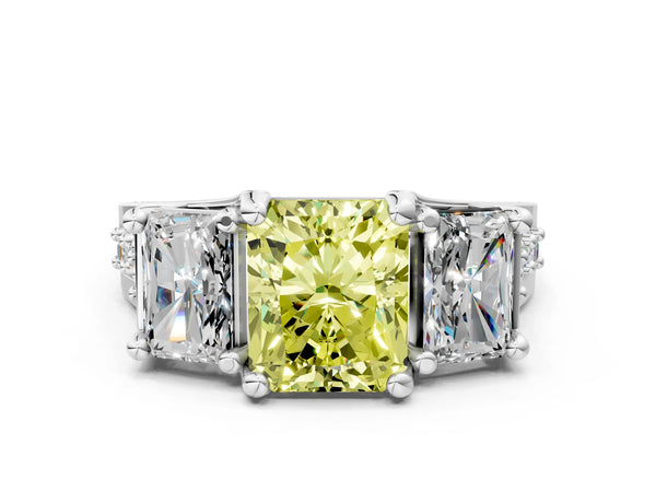 White gold Fancy Yellow Radiant Cut Diamond Three-Stone Ring with Channel Set Band and Four-Prong Setting