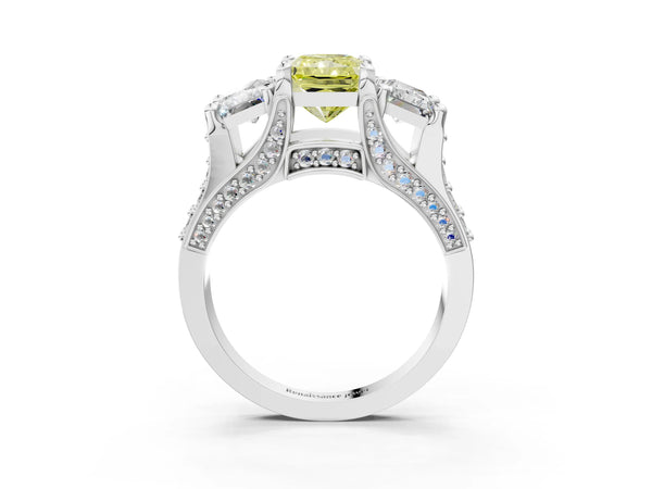 White gold Fancy Yellow Radiant Cut Diamond Three-Stone Ring with Channel Set Band and Four-Prong Setting