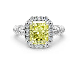 White gold Fancy Yellow Radiant Cut Halo Diamond Solitaire with Filigree Band and Four-Prong Setting