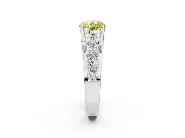 White gold Fancy Yellow Round  Brilliant Solitaire with Side Stones on a Pave Band and Four-Prong Setting