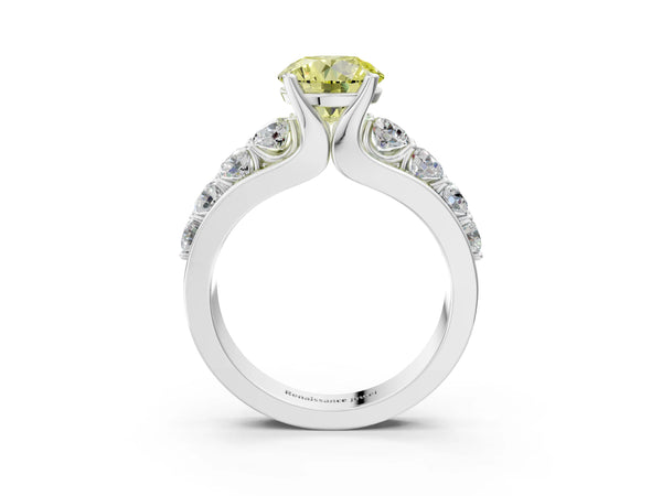 White gold Fancy Yellow Round  Brilliant Solitaire with Side Stones on a Pave Band and Four-Prong Setting