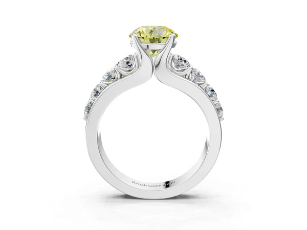 White gold Fancy Yellow Round  Brilliant Solitaire with Side Stones on a Pave Band and Four-Prong Setting