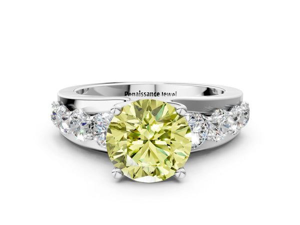 White gold Fancy Yellow Round  Brilliant Solitaire with Side Stones on a Pave Band and Four-Prong Setting