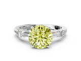 White gold Fancy Yellow Round  Cut Diamond Ring with Baguette Side Stones, Channel Set Band, and Four-Prong Setting