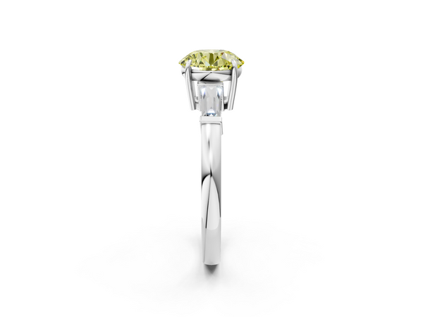 White gold Fancy Yellow Round  Cut Diamond Ring with Tapered Baguette Side Stones in Four-Prong Setting