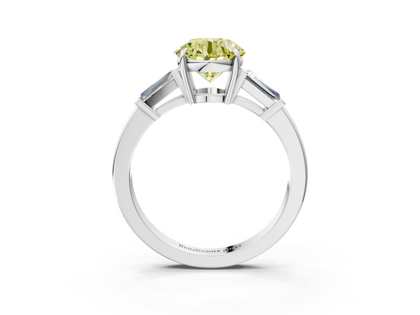 White gold Fancy Yellow Round  Cut Diamond Ring with Tapered Baguette Side Stones in Four-Prong Setting
