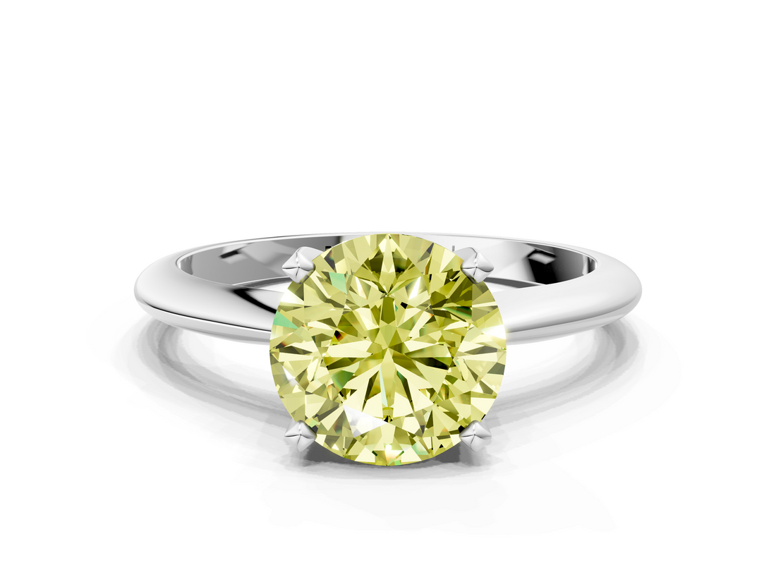 White gold Fancy Yellow Round  Cut Solitaire Ring with Four-Prong Setting on a Classic Band