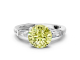 White gold Fancy Yellow Round  Solitaire with Tapered Baguette Side Stones on a Classic Band with Four-Prong Setting