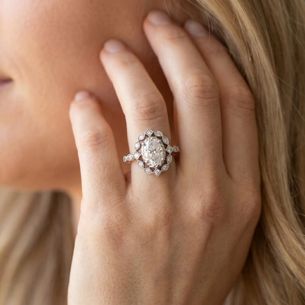 White gold Halo Oval Diamond Milgrain Infinity Band with Four-Prong Setting