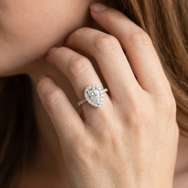 White gold Halo Pear Cut Diamond Pavé Band with Three-Prong Setting