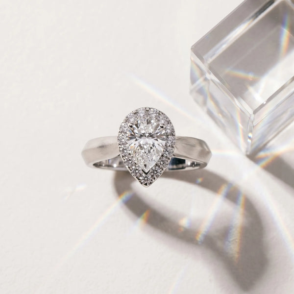 White gold Halo Pear Cut Solitaire Diamond Ring with Prong Setting