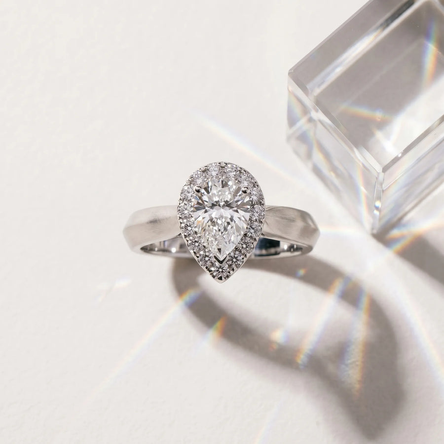White gold Halo Pear Cut Solitaire Diamond Ring with Prong Setting