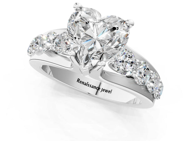 White gold Heart Brilliant Solitaire with Side Stones on a Pave Band and Four-Prong Setting