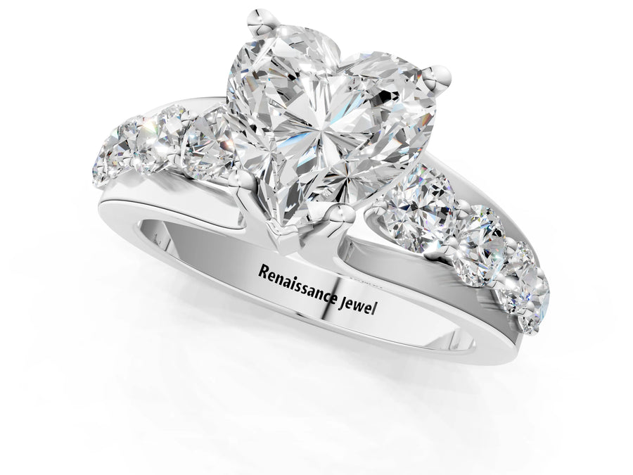 White gold Heart Brilliant Solitaire with Side Stones on a Pave Band and Four-Prong Setting