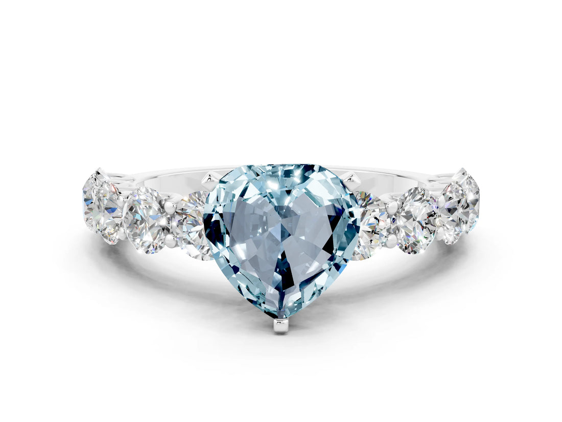 White gold Heart Cut Aquamarine Prong Setting with Side Stones on a Pave Band