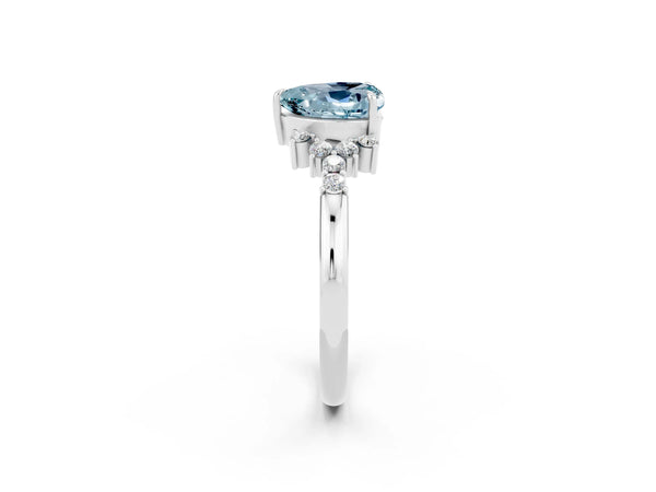 Silver Heart Cut Aquamarine Ring with Side Stones and Four-Prong Setting