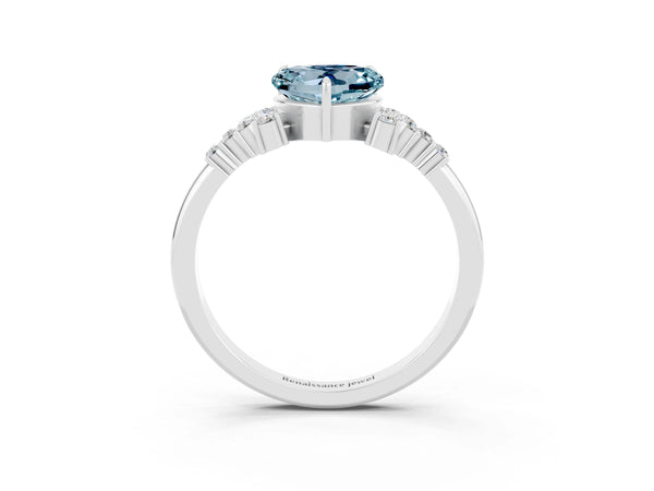 White gold Heart Cut Aquamarine Ring with Side Stones and Four-Prong Setting