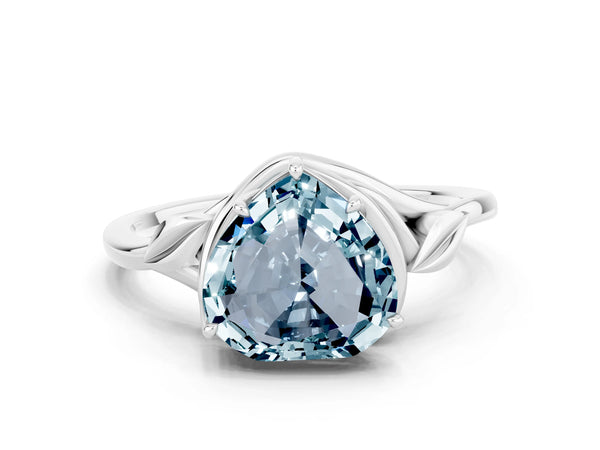 Platinum Heart Cut Aquamarine Solitaire Ring with Twist Band and Four-Prong Setting
