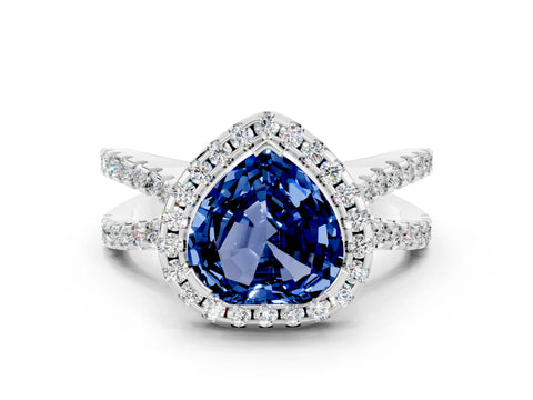 White gold Heart Cut Blue Sapphire Halo Ring with Split Shank Pavé Band and Prong Setting