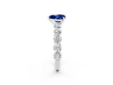 White gold Heart Cut Blue Sapphire Prong Setting with Side Stones on a Pave Band_2