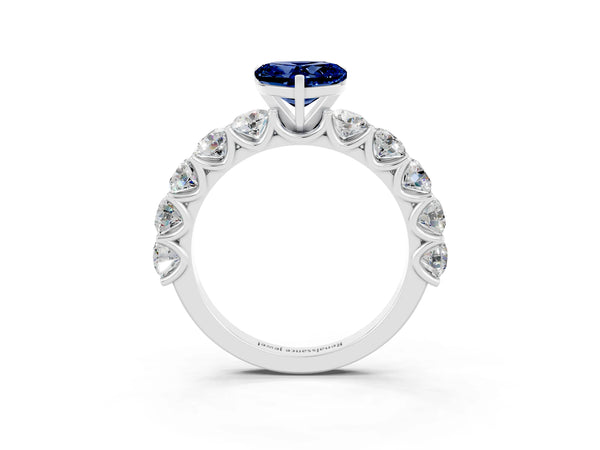 Platinum Heart Cut Blue Sapphire Prong Setting with Side Stones on a Pave Band