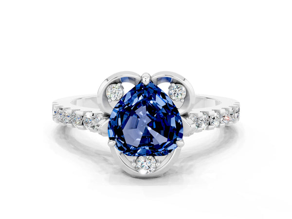 Platinum Heart Cut Blue Sapphire Ring with Pavé Band and Floral Prong Setting