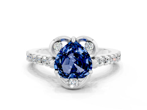 White gold Heart Cut Blue Sapphire Ring with Pavé Band and Floral Prong Setting