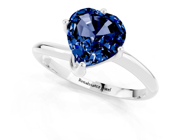 Platinum Heart Cut Blue Sapphire Solitaire Engagement Ring with Four-Prong Setting and Classic Band