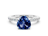 White gold Heart Cut Blue Sapphire Solitaire Engagement Ring with Pavé Band and Four-Prong Setting