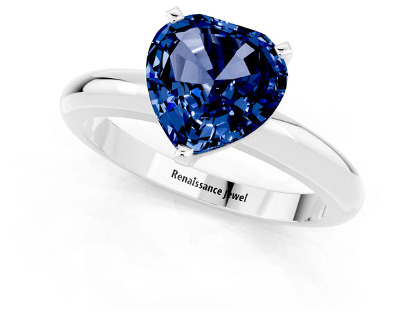 Silver Heart Cut Blue Sapphire Solitaire Engagement Ring with Round Band and Four-Prong Setting