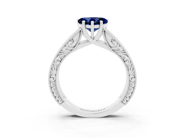 White gold Heart Cut Blue Sapphire Solitaire Ring with Engraved Band and Four-Prong Setting