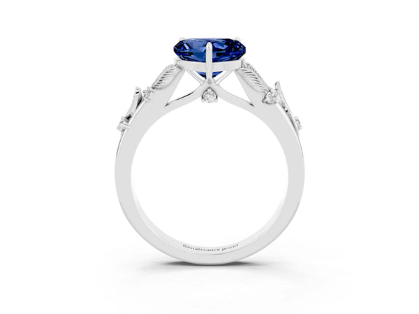 Platinum Heart Cut Blue Sapphire Solitaire Ring with Leaf Motif Band and Four-Prong Setting