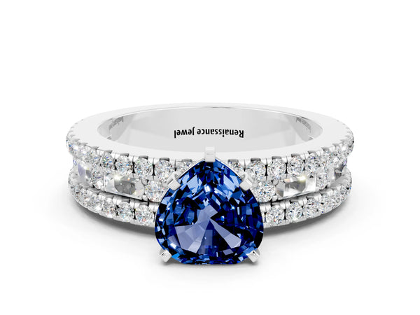Platinum Heart Cut Blue Sapphire Solitaire Ring with Pavé and Channel Set Band