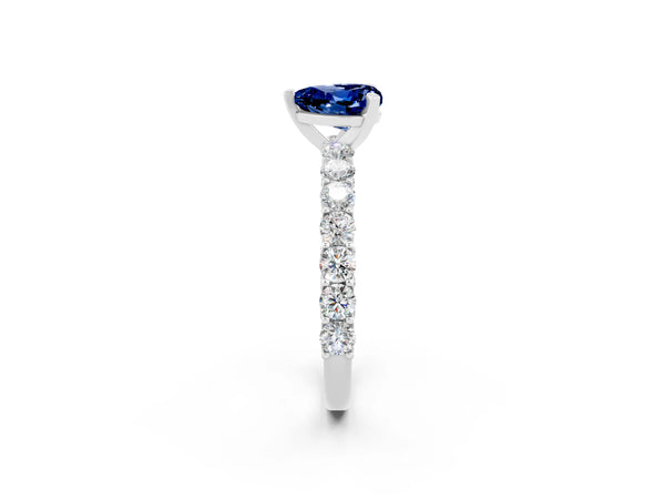 White gold Heart Cut Blue Sapphire Solitaire Ring with Shared Prong Pavé Band and Four-Prong Setting