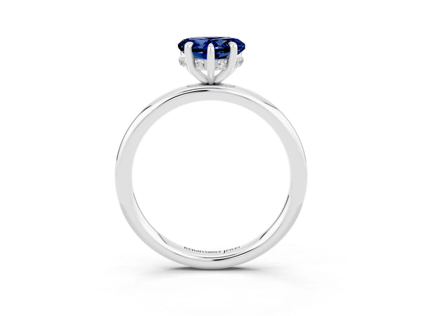 White gold Heart Cut Blue Sapphire Solitaire Ring with Thin Band and Four-Prong Setting