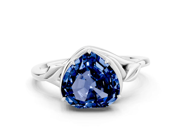 Platinum Heart Cut Blue Sapphire Solitaire Ring with Twist Band and Four-Prong Setting