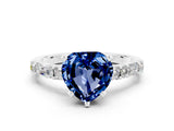 White gold Heart Cut Blue Sapphire Solitaire with Side Baguettes and Channel Set Band