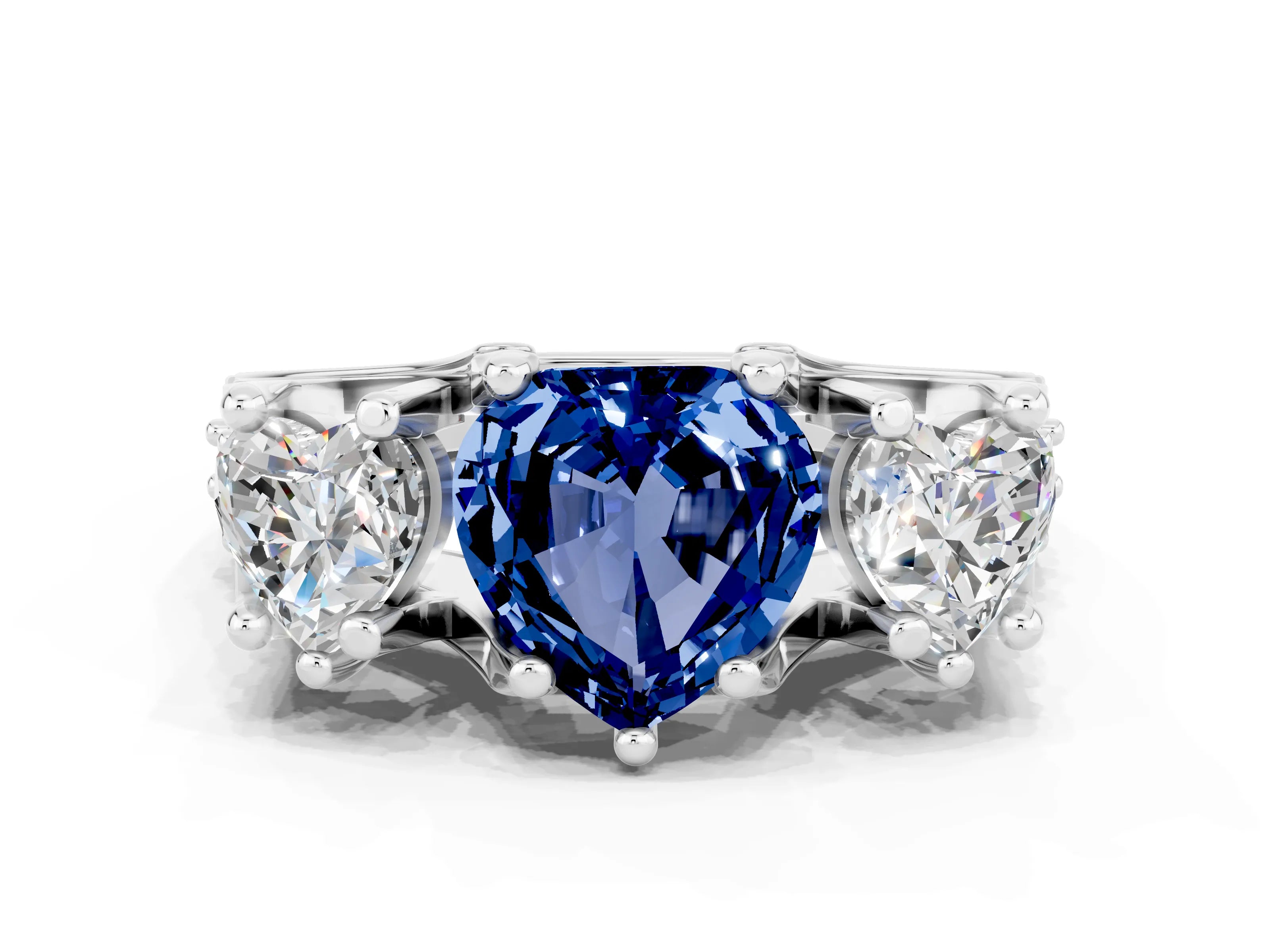 White gold Heart Cut Blue Sapphire Three-Stone Ring with Channel Set Band and Four-Prong Setting