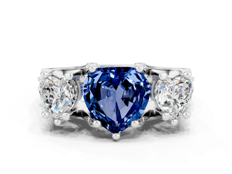 White gold Heart Cut Blue Sapphire Three-Stone Ring with Channel Set Band and Four-Prong Setting