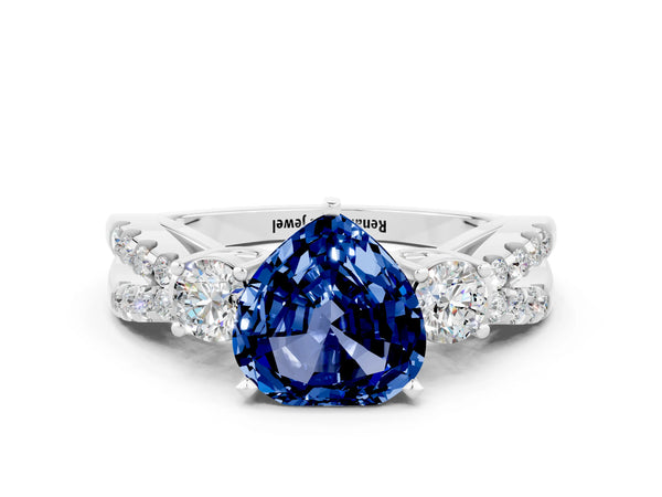 Silver Heart Cut Blue Sapphire Three-Stone Ring with Pavé Split Shank and Four-Prong Setting