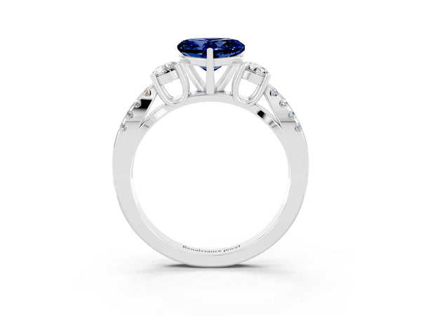 White gold Heart Cut Blue Sapphire Three-Stone Ring with Pavé Split Shank and Four-Prong Setting