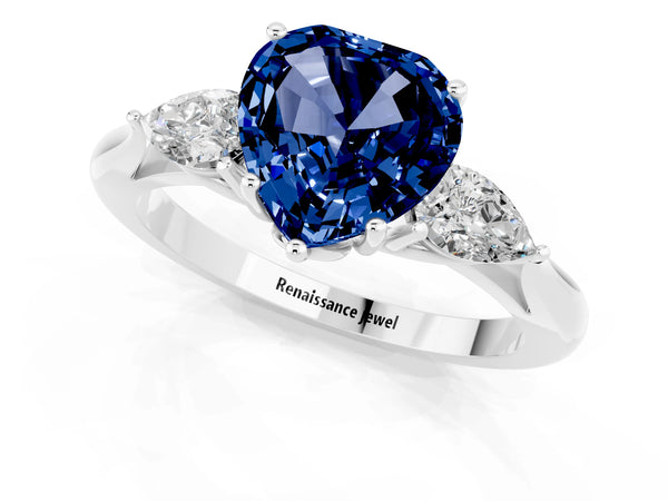 Platinum Heart Cut Blue Sapphire Three-Stone Ring with Pear  Side Stones and Prong Setting