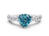 White gold Heart Cut Blue Topaz Prong Setting with Side Stones on a Pave Band