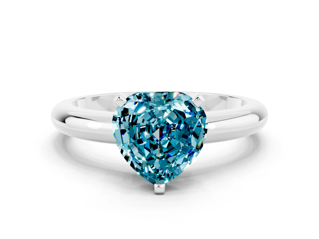 White gold Heart Cut Blue Topaz Solitaire Engagement Ring with Round Band and Four-Prong Setting