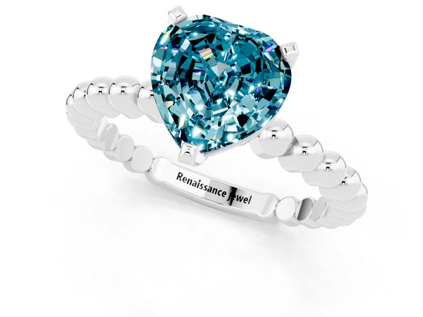 Platinum Heart Cut Blue Topaz Solitaire Ring with Beaded Band and Prong Setting