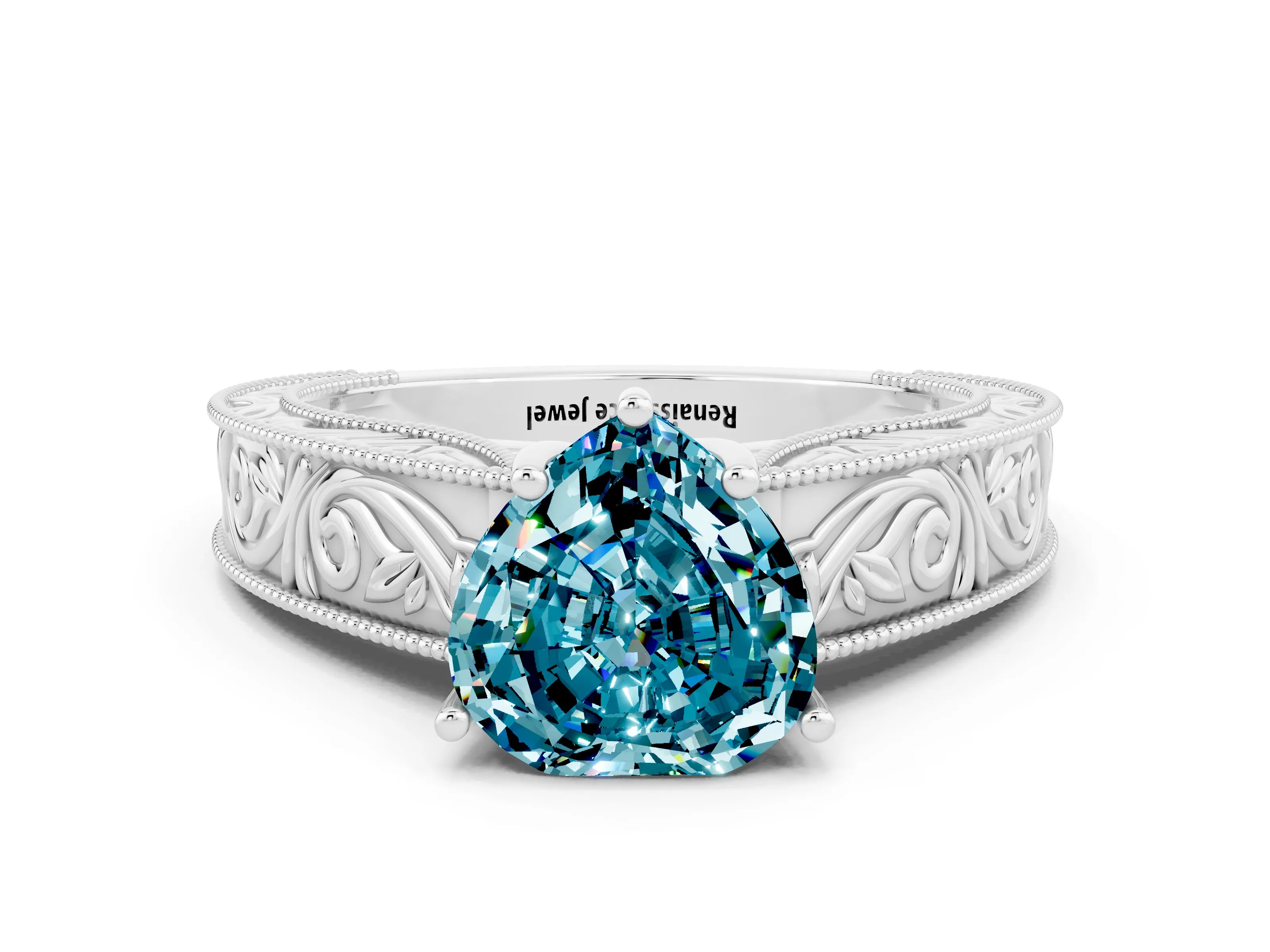 White gold Heart Cut Blue Topaz Solitaire Ring with Engraved Band and Four-Prong Setting