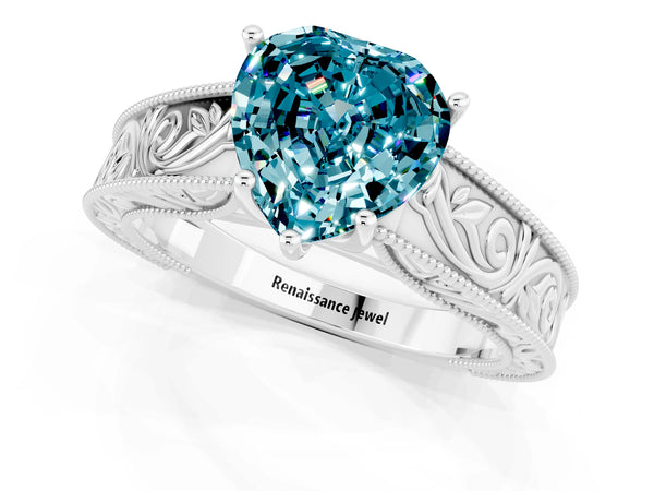 Platinum Heart Cut Blue Topaz Solitaire Ring with Engraved Band and Four-Prong Setting