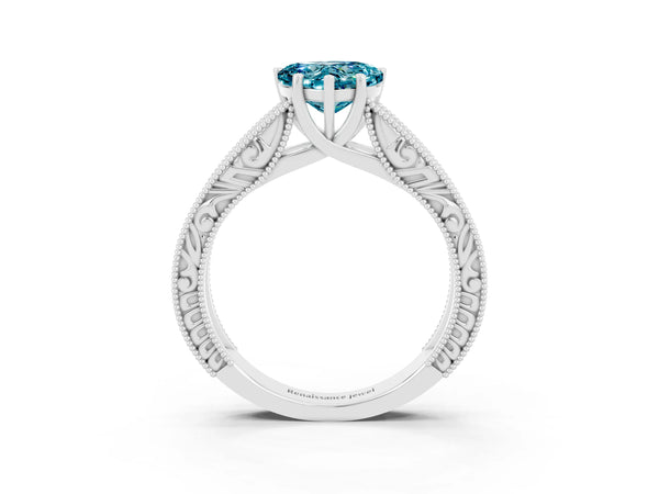 Platinum Heart Cut Blue Topaz Solitaire Ring with Engraved Band and Four-Prong Setting