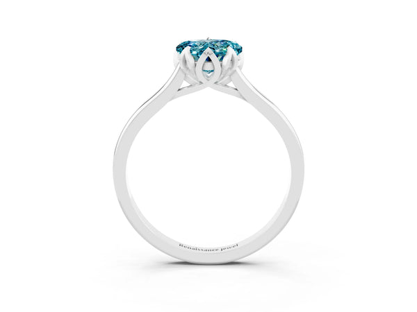 Platinum Heart Cut Blue Topaz Solitaire Ring with Flower Prong Setting and Classic Band